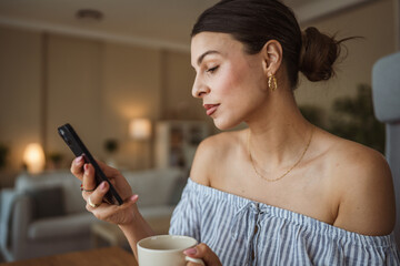 beautiful woman text messages or explore internet on mobile phone