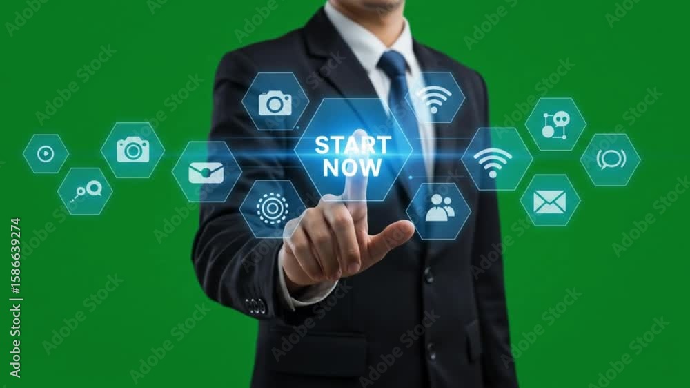 Poster man in suit pointing at start now button surrounded by icons on a digital interface on green screen
