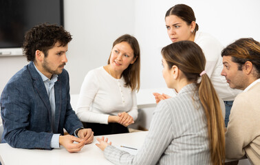 Team building for employees discussing problems of work, feeling psychological support during...