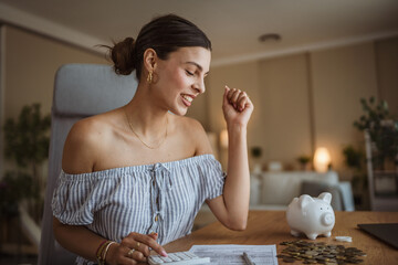 adult woman use calculate machine and review home bills and savings