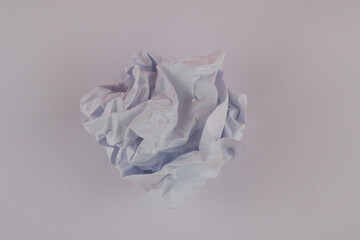 Crumpled paper ball isolated on white background.