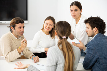 Team building for employees discussing problems of work, feeling psychological support during...