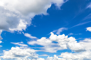 Bright Blue Sky with White Clouds Background