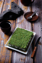 Green biscuit cake with cream cheese filling in a plate