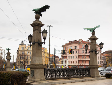 Busy traffic on ancient bridge over Perlovska River passes through Orlov Bridge. Historical architectural landmark. Bridges supports decorated with statues of eagles, symbol of freedom and defiance.