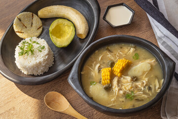 Traditional Colombian Ajiaco with Rice, Avocado and Arepa