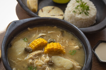 Traditional Colombian Ajiaco with Rice, Avocado and Arepa
