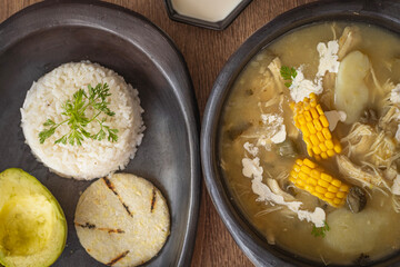 Traditional Colombian Ajiaco with Rice, Avocado and Arepa