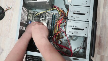 technician hold the screwdriver for repairing the laptop. computer hardware, repairing, upgrade and...