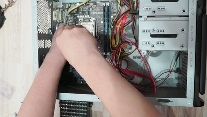 technician hold the screwdriver for repairing the laptop. computer hardware, repairing, upgrade and technology. professional technicial at workplace concentrated. focus on hands