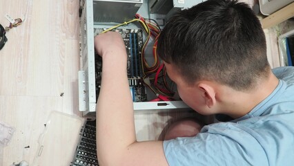 technician hold the screwdriver for repairing the laptop. computer hardware, repairing, upgrade and technology. professional technicial at workplace concentrated. focus on hands