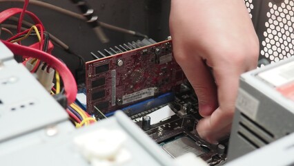 technician hold the screwdriver for repairing the laptop. computer hardware, repairing, upgrade and technology. professional technicial at workplace concentrated. focus on hands