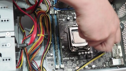 technician hold the screwdriver for repairing the laptop. computer hardware, repairing, upgrade and technology. professional technicial at workplace concentrated. focus on hands