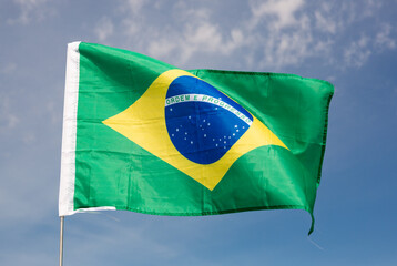 Brazil flag waving against the blue sky