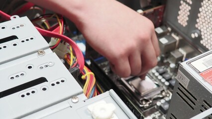 technician hold the screwdriver for repairing the laptop. computer hardware, repairing, upgrade and technology. professional technicial at workplace concentrated. focus on hands