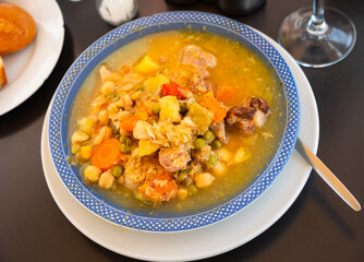 Popular dish of Spanish cuisine is Cocido de garbanzos, made from meat, vegetables and chickpeas