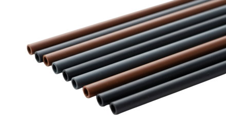 Set of reusable black and brown straws on white background  