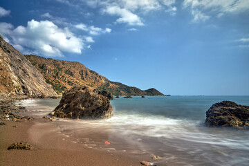 Lonely rocks and a stone cliff on the sea coast of Zakynthos Island