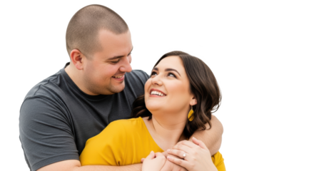 A smiling couple embracing each other with the woman in yellow looking up at the man in a gray shirt