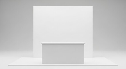 Minimalist white booth setup with a counter and a backdrop, simple and clean.