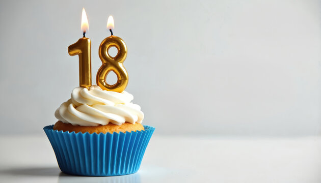 Golden number 18 candle atop blue-wrapped cupcake with white frosting. Celebrate birthdays, anniversaries, or special events with this festive dessert. Elegant design, sweet treat perfect for parties.