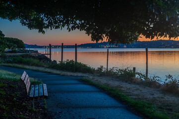 View From Seacrest Park of the Sunrise Over the City Of Seattle, Washington. One of the best places to enjoy the view of Seattle is in West Seattle looking across Elliott Bay from Seacrest Park.