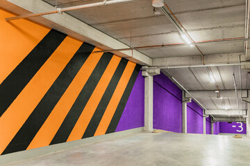 triped orange and black wall on parking level -2