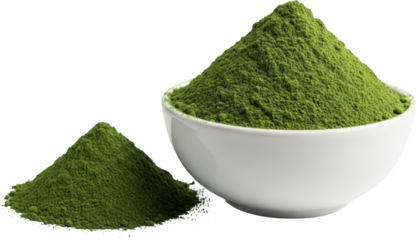 A white bowl filled with green powder next to a small pile of powder heap transparent background
