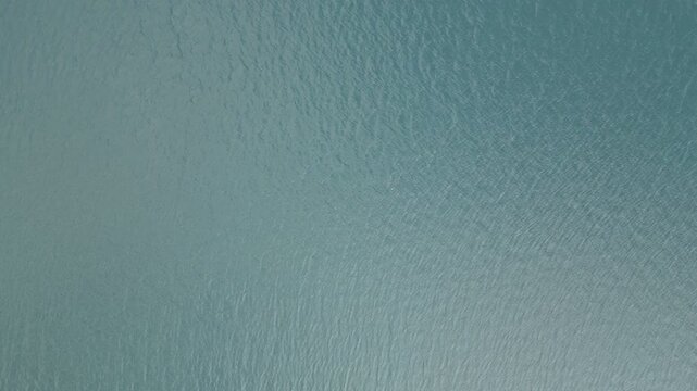 A drone video of rippling water surface.