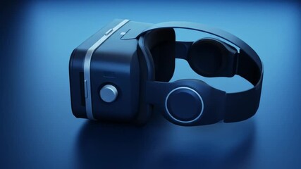 A black virtual reality headset with a green screen display on a dark blue reflective surface studio shot - Powered by Adobe