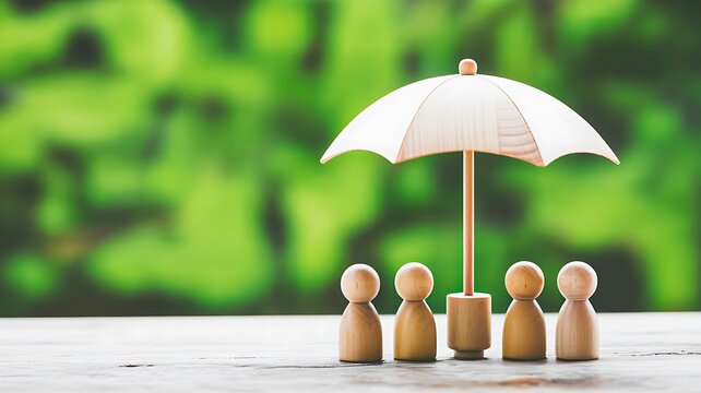 Wooden human figures under white umbrella symbolizing family protection and safety
