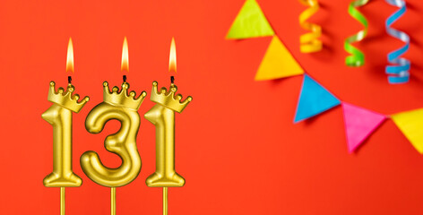 Number 131 candle - Birthday celebration on an orange background with pennants