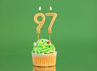 Birthday card with candle and cupcake - Number 97 on a green background