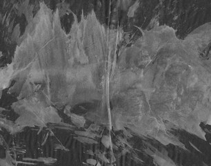 Abstract black and white grunge background. Paper textured dirty overlay. Washed dirty backdrop.