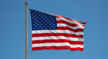 Obraz premium American flag waving in clear sky