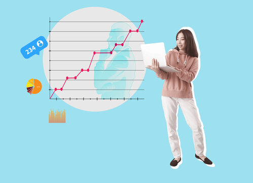 Happy young female Asian programmer with laptop on blue background