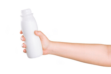 Hand holding a bottle of milk isolated on white background.