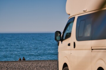 Exploring the beautiful coastline of Kaikoura, New Zealand with campervan and relaxing by the ocean