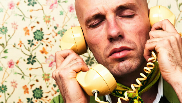 Bald Man Using Vintage Rotary Telephone