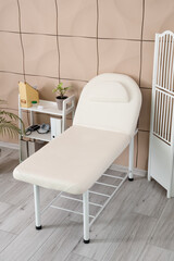 Interior of medical office with couch and shelf unit