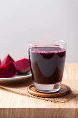 Fresh beetroot juice in glass on wooden board, Healthy drink