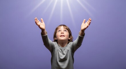 Photo of a joyful child with hands raised towards the light, looking up with a happy expression, symbolizing hope, faith, and spiritual connection against a purple background