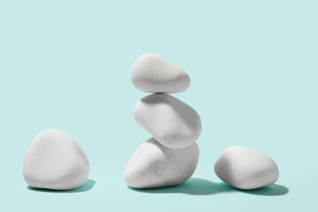 Many white pebbles on blue background