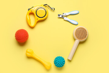 Frame made of lead and different pet accessories on yellow background