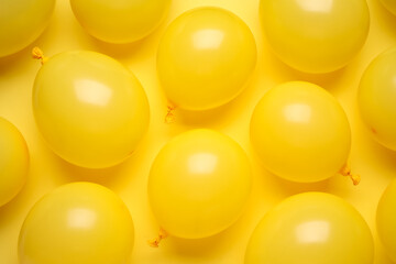 Composition with air balloons on yellow background, closeup