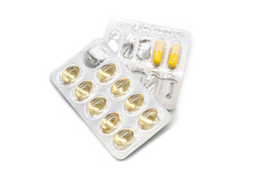 Blister Pack of Pills and Capsules isolated on White Background with copy space. Healthcare, medicine, pharmacy, supplements, and pharmaceutical treatment concepts.
