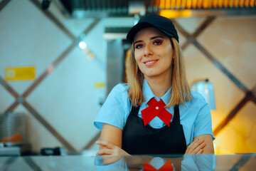 Happy Fast-food Worker Smiling from Over the Counter. Cheerful waitress being friendly and...