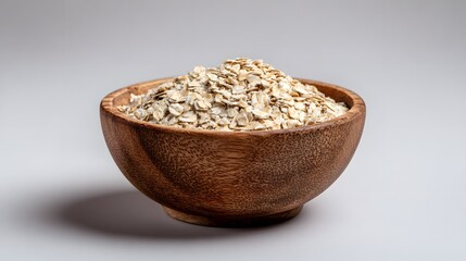 Oatmeal in wooden bowl healthy breakfast food ingredient fiber rich diet plan