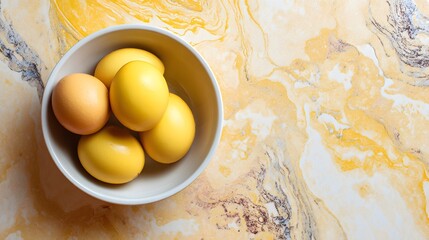 Top view of Easter eggs in bowl on marble background Easter holiday concept