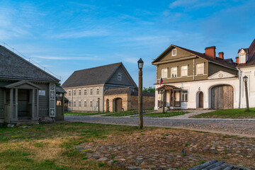 View of historical merchant buildings of estates on the main street of Izborsk Pechorskaya Street...